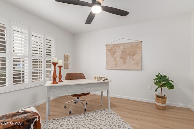 office space featuring ceiling fan and light hardwood / wood-style flooring