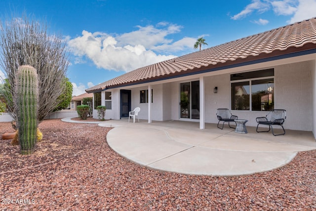 rear view of property with a patio area