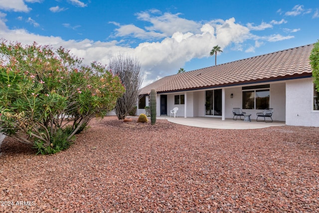 rear view of house with a patio area