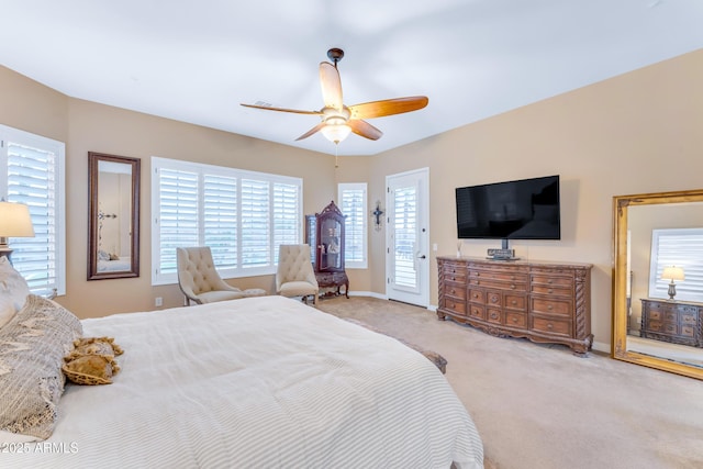 bedroom featuring light carpet, ceiling fan, and access to outside