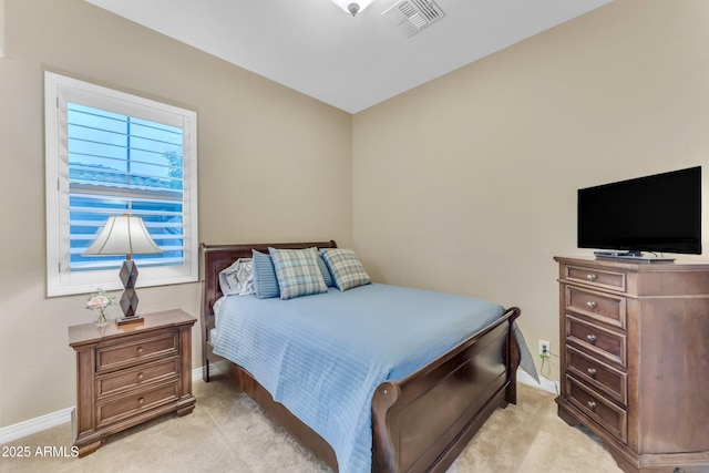 bedroom with light carpet