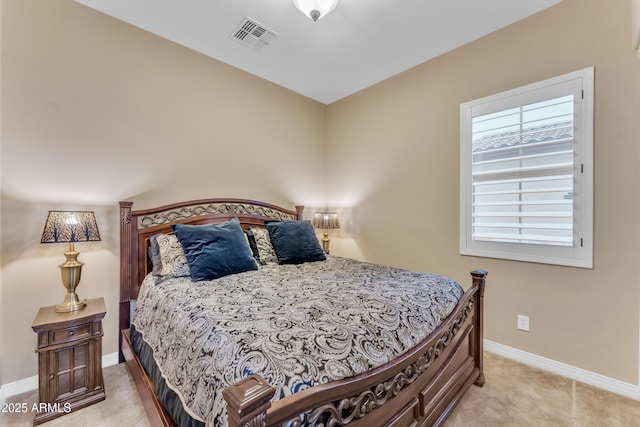 bedroom with light colored carpet