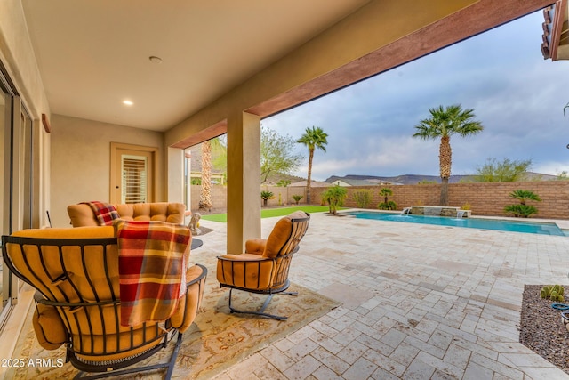 view of patio with a fenced in pool