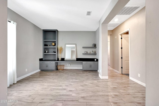 unfurnished office with visible vents and baseboards