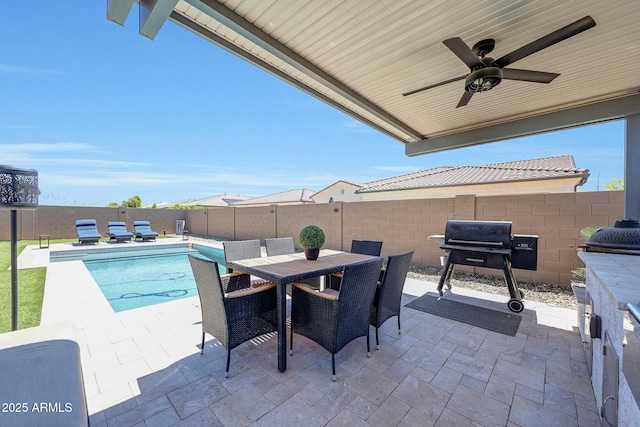 view of patio / terrace with ceiling fan, grilling area, outdoor dining area, a fenced backyard, and a fenced in pool