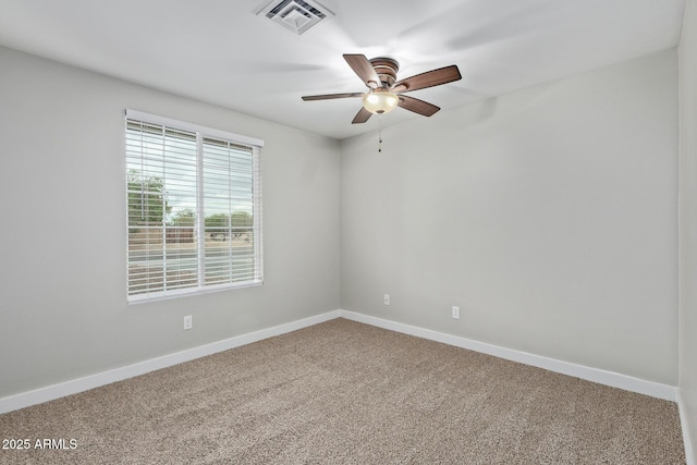 unfurnished room featuring ceiling fan, carpet flooring, and baseboards