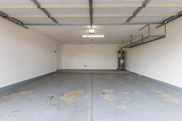 garage featuring water heater, baseboards, and a garage door opener