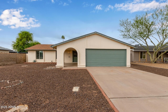 single story home featuring a garage, driveway, fence, and a shingled roof