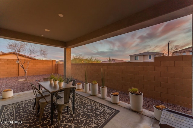 view of patio terrace at dusk