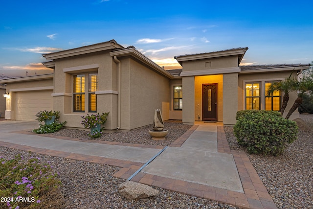 prairie-style home featuring a garage