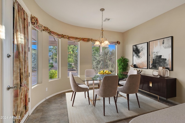 dining room featuring a notable chandelier