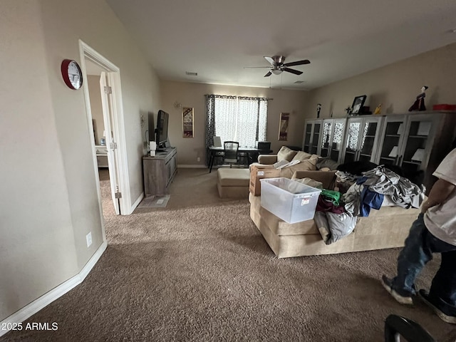 living room featuring ceiling fan and carpet flooring