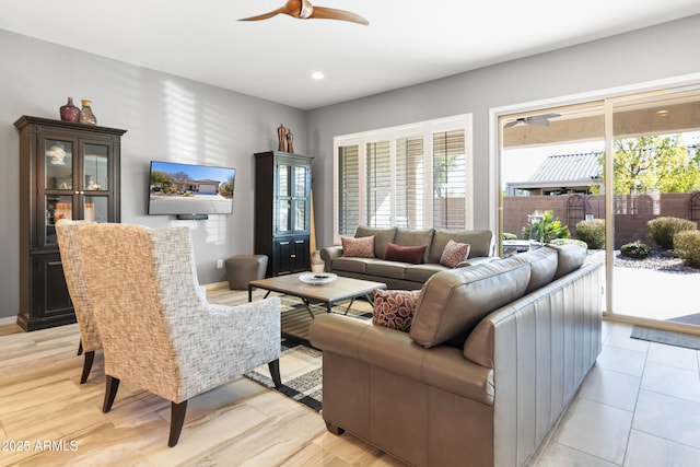 living area with a ceiling fan and recessed lighting