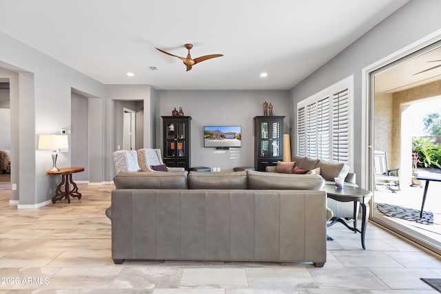 living area featuring a ceiling fan, recessed lighting, visible vents, and baseboards