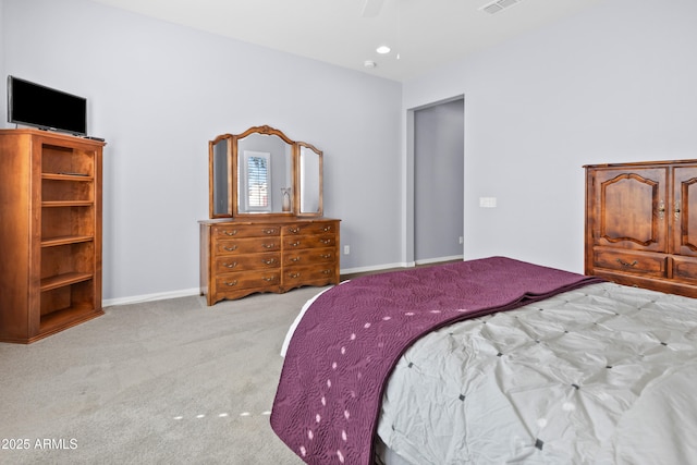 bedroom with a ceiling fan, carpet flooring, visible vents, and baseboards