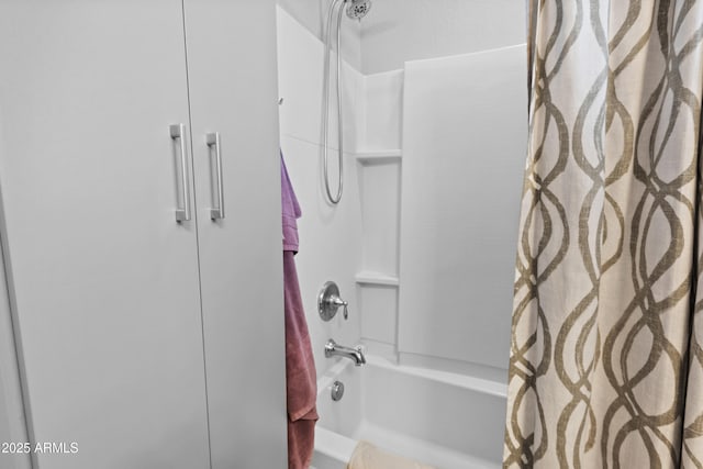 bathroom with shower / bath combination with curtain