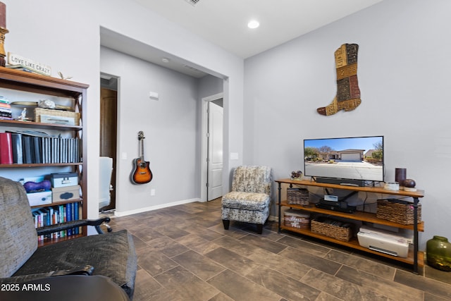 sitting room featuring baseboards and recessed lighting