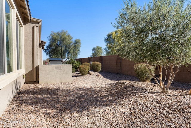 view of yard with a fenced backyard