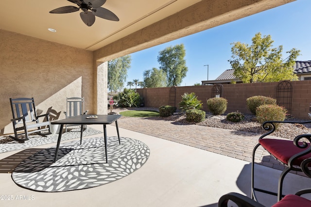 view of patio featuring a fenced backyard and ceiling fan