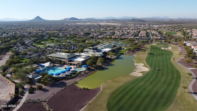 aerial view with a residential view, golf course view, and a water and mountain view