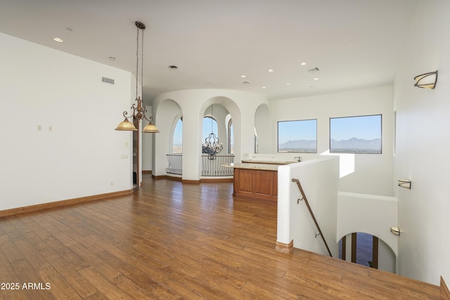 interior space with plenty of natural light and dark wood-type flooring