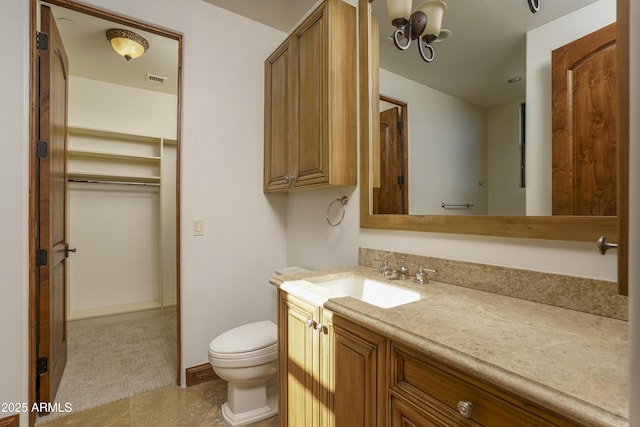 bathroom with tile patterned floors, vanity, and toilet