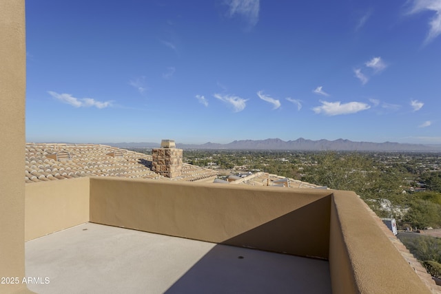 exterior space with a mountain view and a balcony