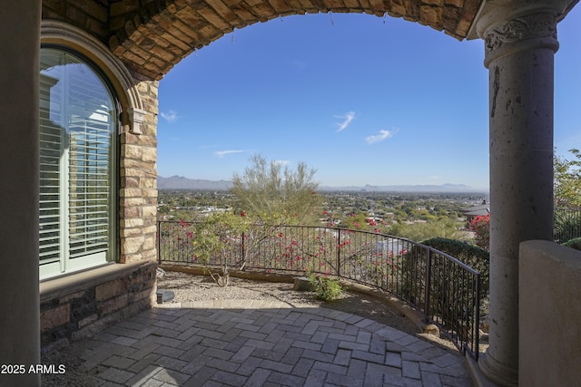 balcony with a patio area and a mountain view