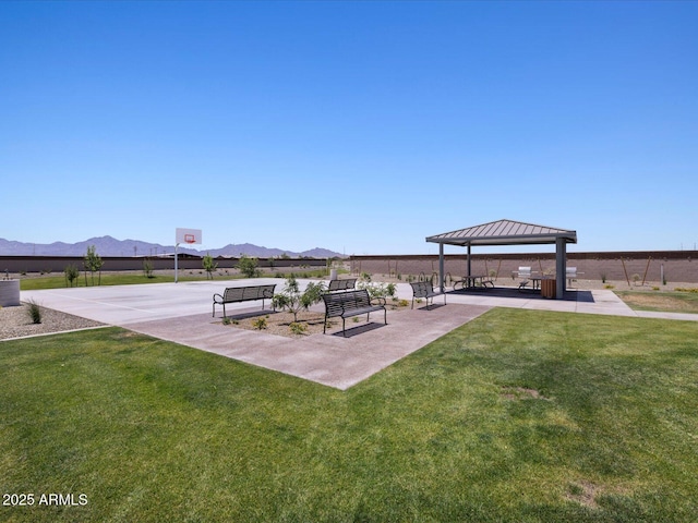 exterior space with community basketball court, a mountain view, and a gazebo