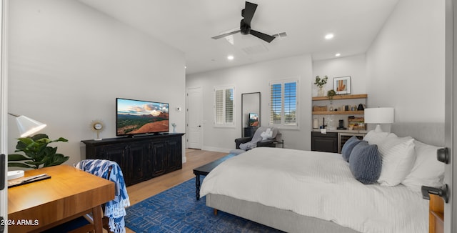 bedroom featuring hardwood / wood-style flooring and ceiling fan