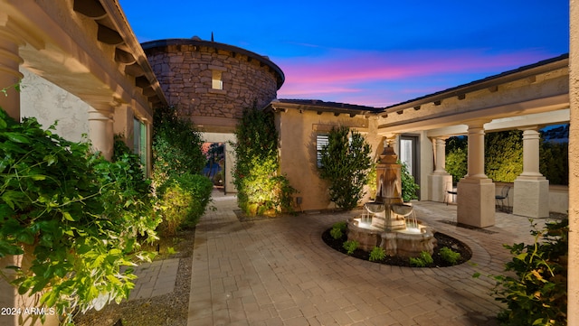 view of patio terrace at dusk