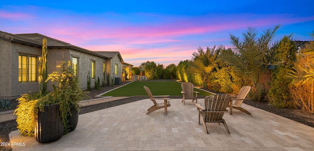 view of patio terrace at dusk