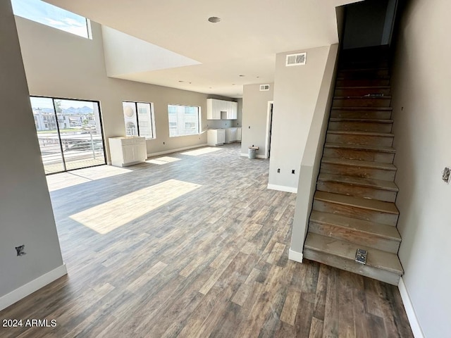 stairway featuring wood-type flooring