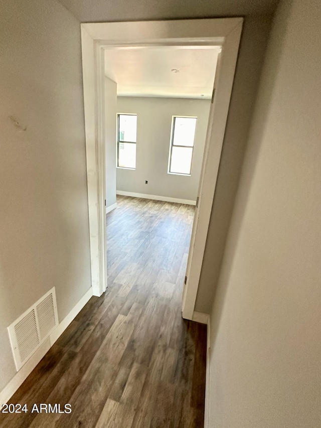 corridor featuring dark hardwood / wood-style flooring