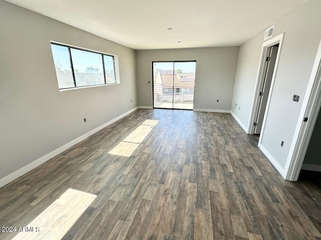 unfurnished room featuring dark hardwood / wood-style floors