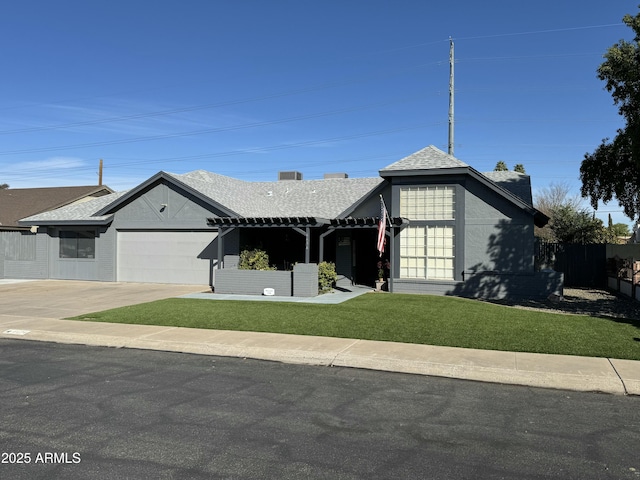 view of front facade featuring a garage and a front lawn