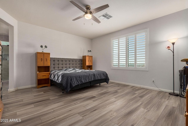 bedroom with ceiling fan and light wood-type flooring