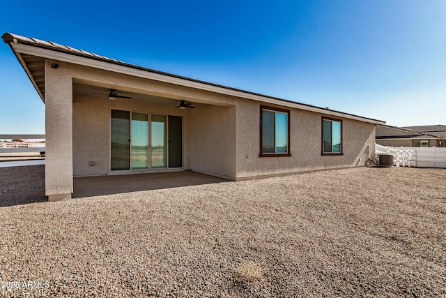 back of house with ceiling fan, central AC unit, and a patio