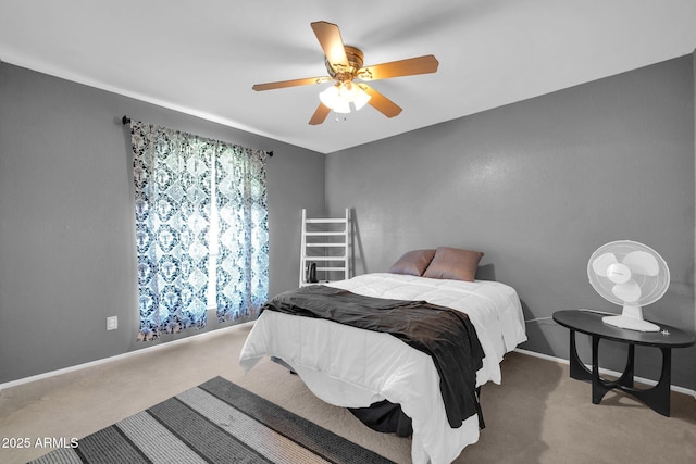 bedroom featuring ceiling fan, carpet, and baseboards