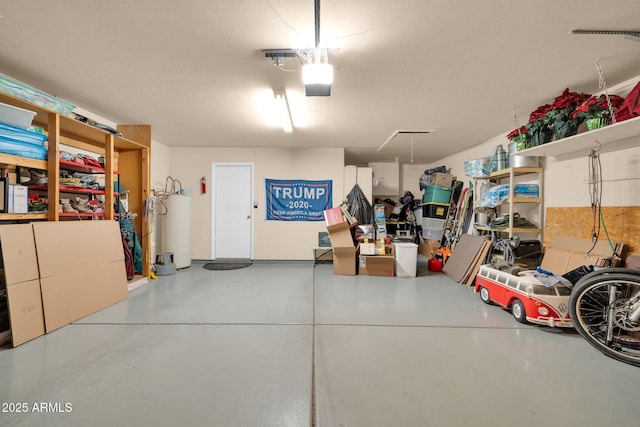 garage with gas water heater and a garage door opener