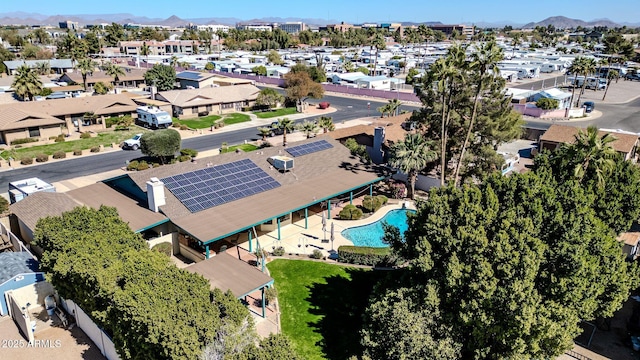 birds eye view of property with a mountain view and a residential view