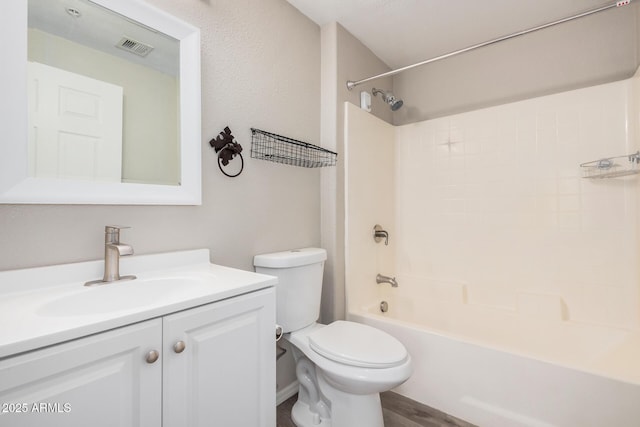 full bathroom with vanity, tub / shower combination, and toilet