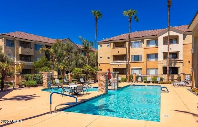 view of swimming pool featuring a patio