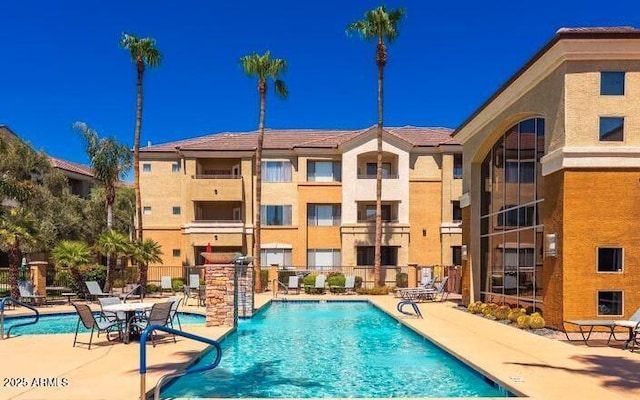 view of swimming pool with a patio