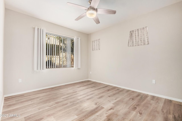 spare room featuring light hardwood / wood-style flooring and ceiling fan