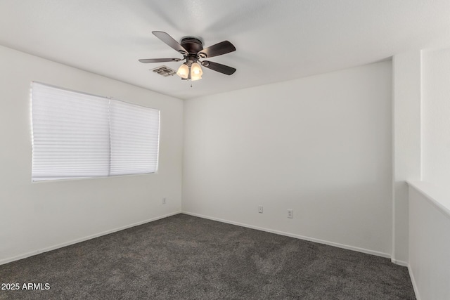 12825 W Virginia Ave, Avondale, AZ 85392 - empty room with dark colored carpet and ceiling fan