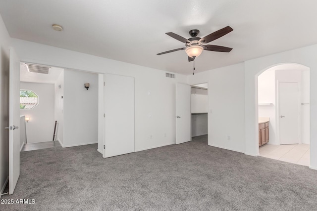 12825 W Virginia Ave, Avondale, AZ 85392 - unfurnished room featuring light colored carpet, ceiling fan, and arched walkways