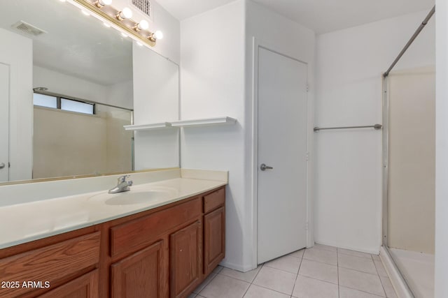 12825 W Virginia Ave, Avondale, AZ 85392 - bathroom featuring a stall shower, vanity, and tile patterned flooring