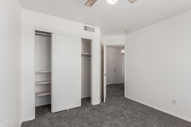 12825 W Virginia Ave, Avondale, AZ 85392 - unfurnished bedroom with dark carpet, a closet, and ceiling fan