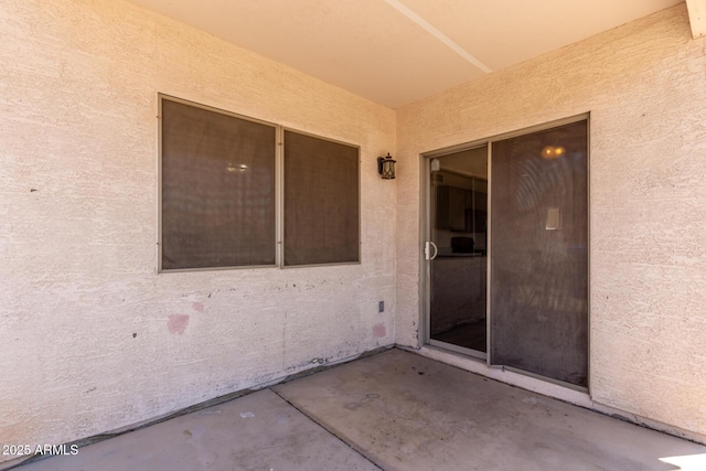 12825 W Virginia Ave, Avondale, AZ 85392 - doorway to property featuring stucco siding and a patio area